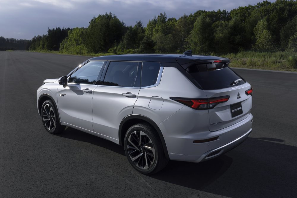 The 2023 Outlander PHEV driving on the street