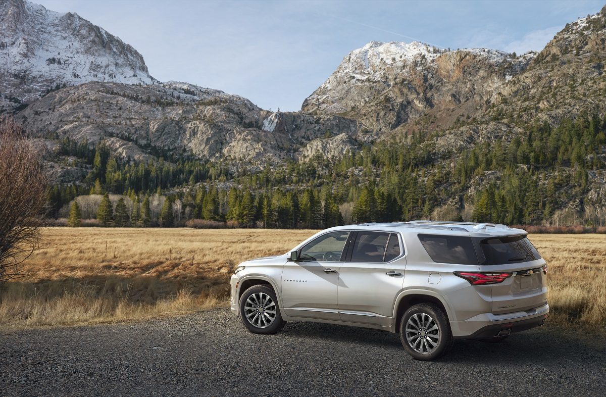 Rear side view of 2022 Chevrolet Traverse Premier against mountain backdrop