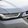 Close-up view of 2022 Chevrolet Traverse Premier headlamp and grille