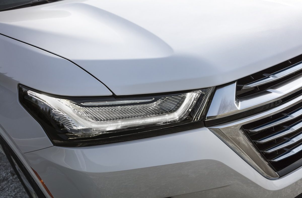 Close-up view of 2022 Chevrolet Traverse Premier headlamp and grille