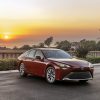 2022 Toyota Mirai XLE in Supersonic Red (parked, sunset)