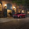 Red 2022 Chevrolet Malibu parked on a street at night