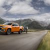 Front side view of 2021 Chevrolet Colorado towing trailer of motorbikes in the mountains