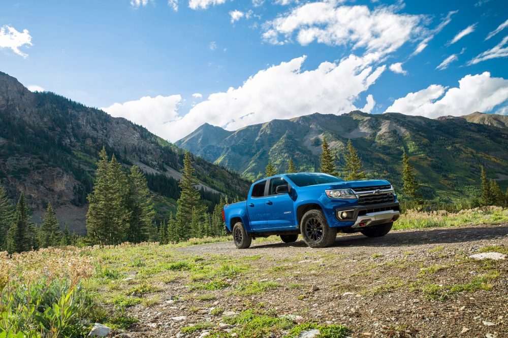 Front side view of 2022 Chevrolet Colorado parked against mountain backdrop