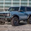 The 2022 Ford Bronco poses in front of Ford World Headquarters after winning the 2022 North American Utility Vehicle of the Year award