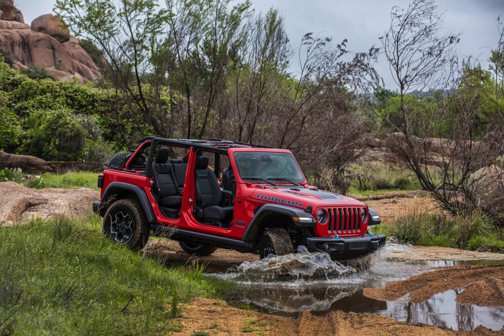 2022 Jeep® Wrangler Sahara 4xe on trail getting ready to cross water