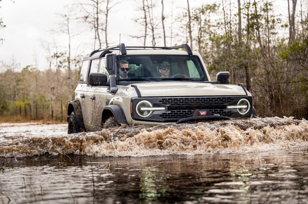 2022 Ford Bronco Everglades in Desert Sand fording through water from front