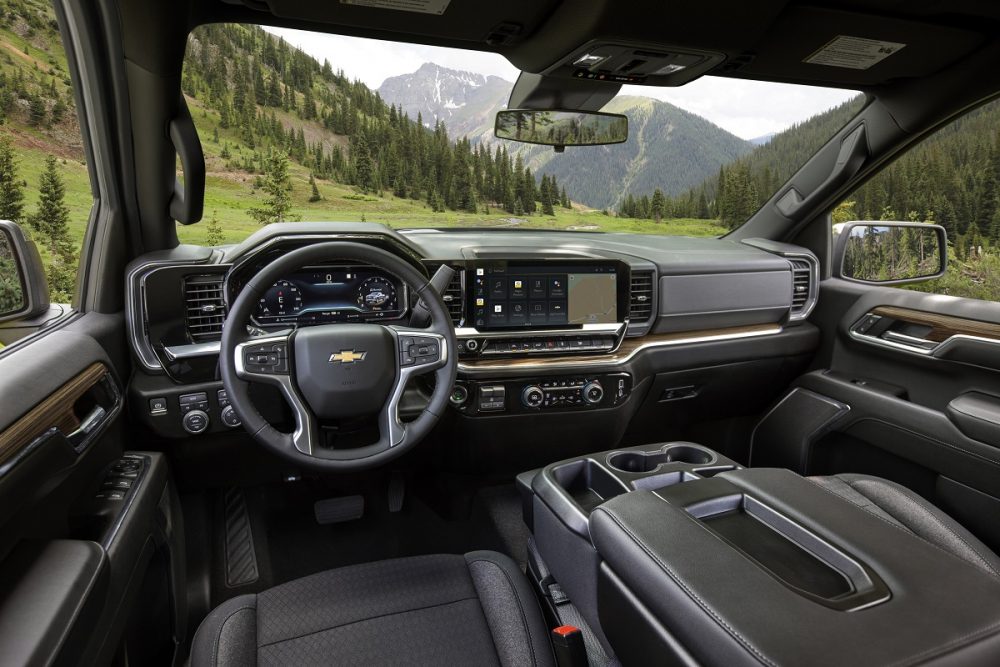 Angled view of 2022 Chevrolet Silverado LT seats, steering wheel, console, dashboard, and windshield