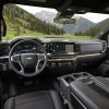 Angled view of 2022 Chevrolet Silverado LT seats, steering wheel, console, dashboard, and windshield