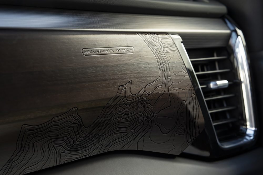 Close-up of laser-etched wood in 2022 GMC Sierra Denali Ultimate cabin