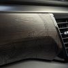 Close-up of laser-etched wood in 2022 GMC Sierra Denali Ultimate cabin