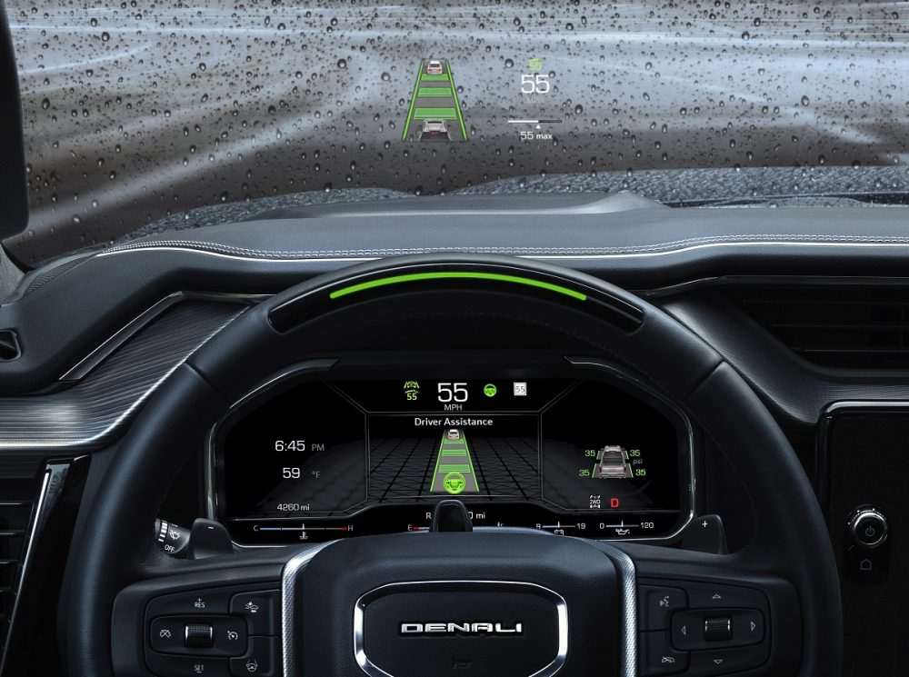 Close-up of 15-inch head-up display, steering wheel, and 12.3-inch driver display in 2022 GMC Sierra Denali Ultimate cabin