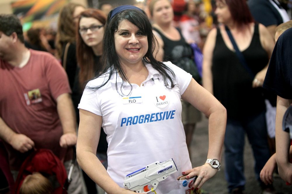 Person dressed up as Flo from Progressive at a comic convention