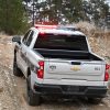 Rear view of 2023 Chevrolet Silverado PPV driving off-road