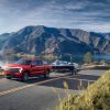 Ford F-150 Lightning towing a boat down a mountain road