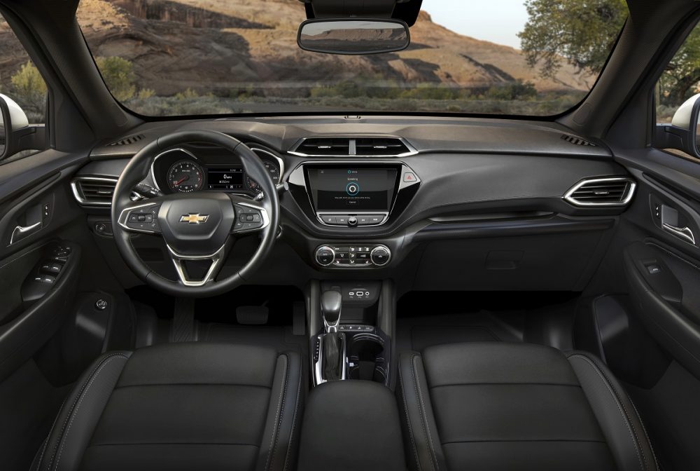 Front-facing view of 2023 Chevrolet Trailblazer front-row seats, steering wheel, dashboard, and windshield