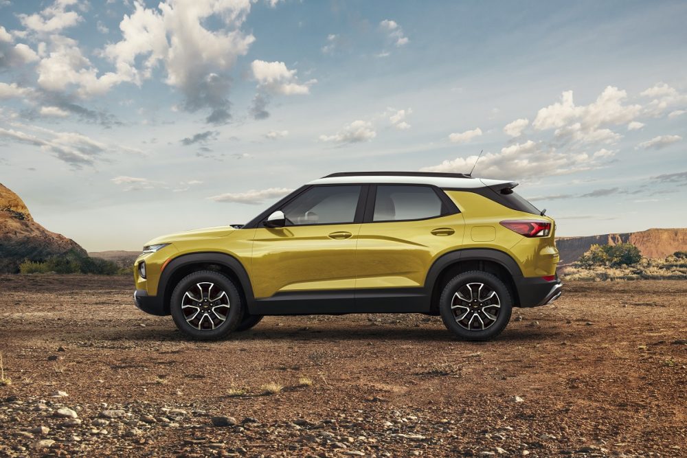 Profile view of yellow 2023 Chevrolet Trailblazer ACTIV parked with desert in background