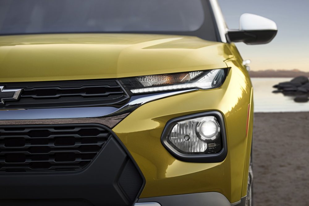 Front close-up view of yellow 2023 Chevrolet Trailblazer ACTIV grille and headlights