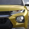 Front close-up view of yellow 2023 Chevrolet Trailblazer ACTIV grille and headlights