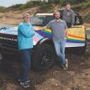 Ford Pride members Bill Peters, Eric Mutrynowski, and Alex Buckner with Dash, the Ford Pride Bronco