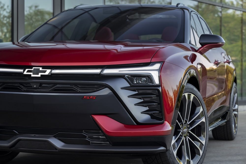 Close-up front view of red 2024 Chevrolet Blazer EV SS grille and headlights