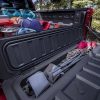 Close-up of 2023 Chevrolet Colorado Trail Boss tailgate storage compartment