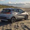 Rear side view of Chevrolet Bolt EUV parked on beach