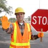 Construction Worker Crossing Guard Holding Stop Sign