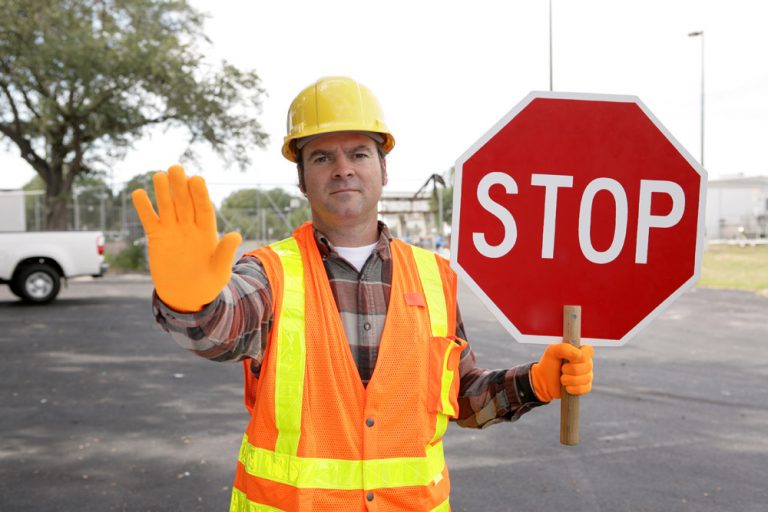 Construction Worker Crossing Guard Holding Stop Sign