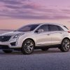 2023 Cadillac XT5 Premium Luxury shown in Crystal White Tricoat with 20” alloy wheels, front 3/4 angle