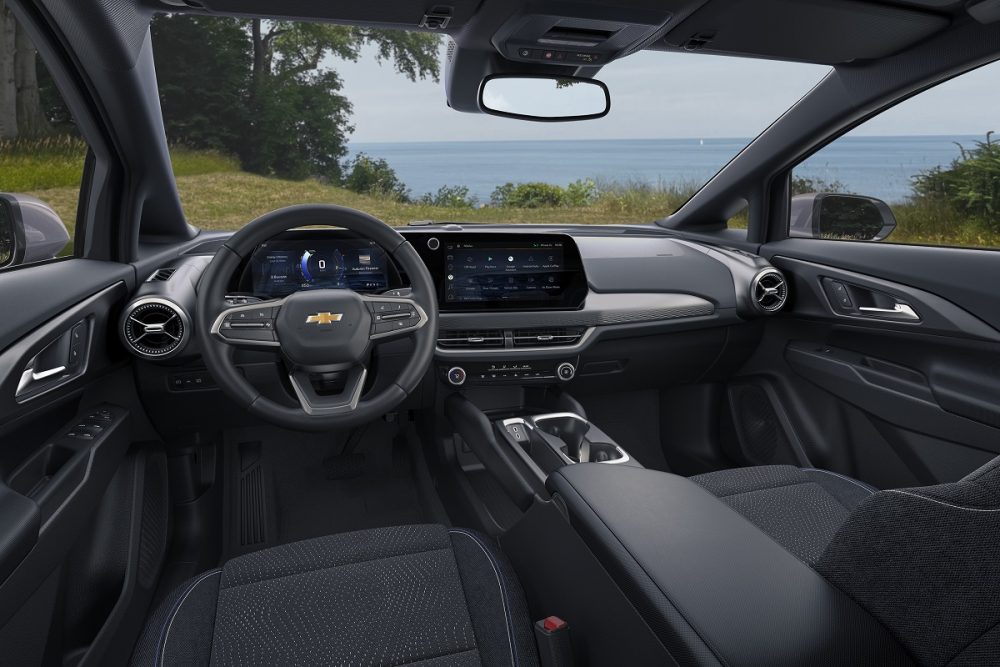 Steering wheel, console, touch screen, and front seats in 2024 Chevrolet Equinox EV 1LT