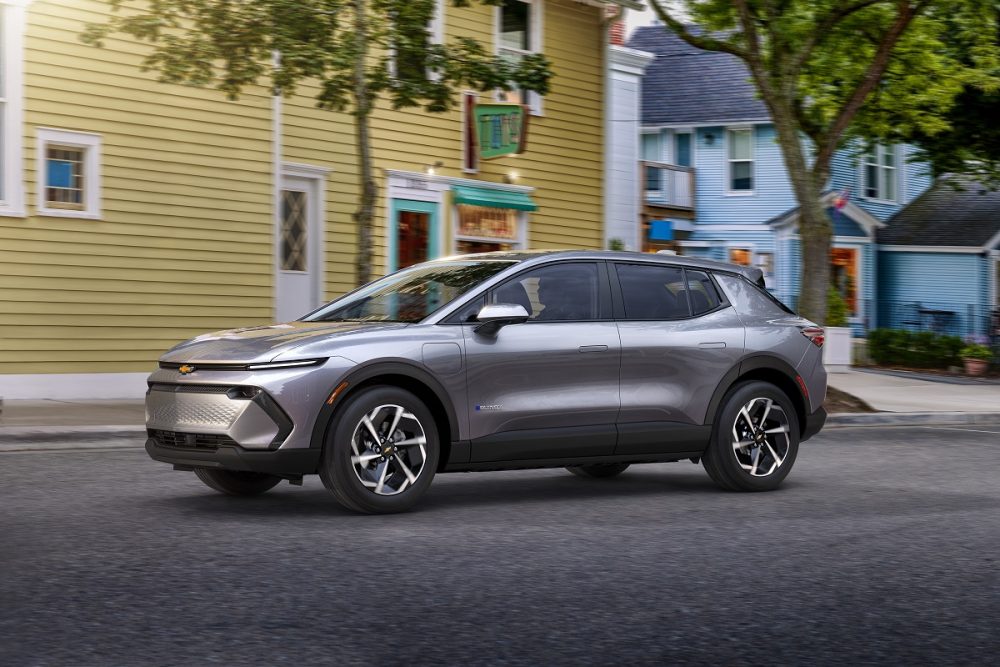 Front side view of 2024 Chevrolet Equinox EV 1LT parked in front of building