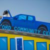 A recreation of the Ford F-150 Lightning powers a Ford Resource and Engagement Center on Ford's Thanksgiving parade float