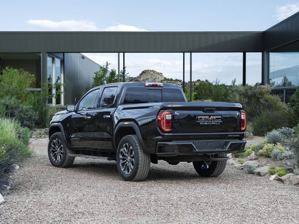 Rear side view of parked 2023 GMC Canyon Denali