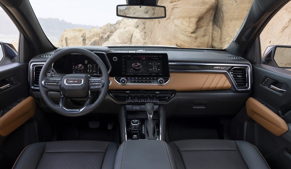 Front seats, steering wheel, dashboard, and infotainment screen of 2023 GMC Canyon AT4