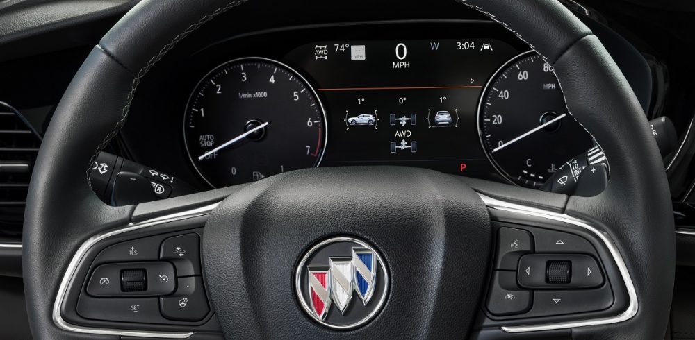 Close-up view of 2023 Buick Envision steering wheel and instrument display