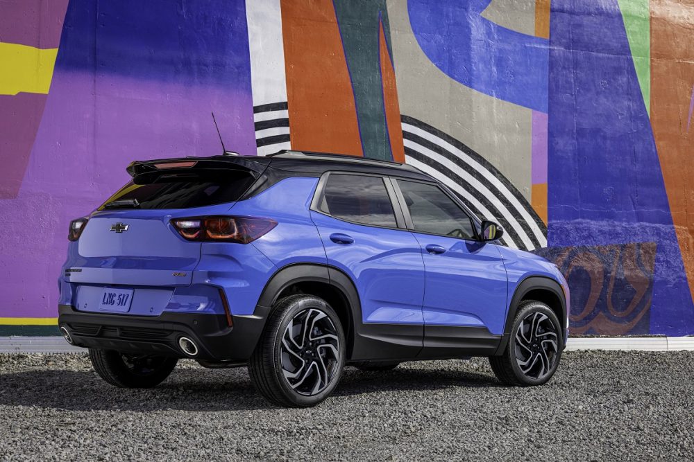 Rear side view of 2024 Chevrolet Trailblazer RS in front of painted wall