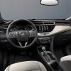 Inside view of 2023 Buick Encore GX front seats, steering wheel, and dashboard
