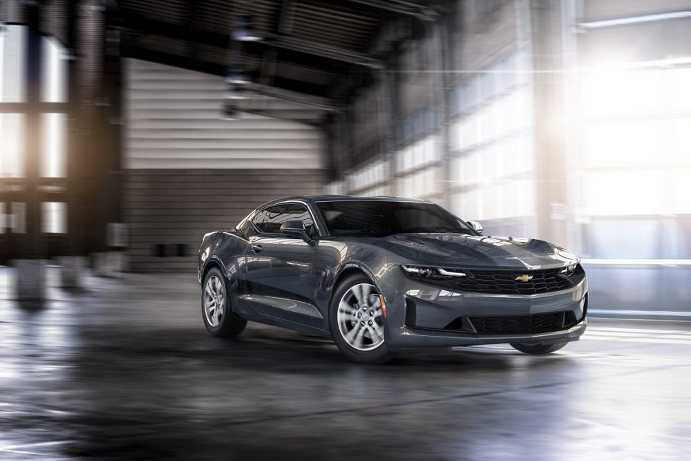 Passenger front 3/4 view of Chevrolet Camaro cornering inside a garage