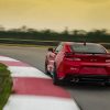 Rear view of 2023 Chevrolet Camaro ZL1 cornering on a track