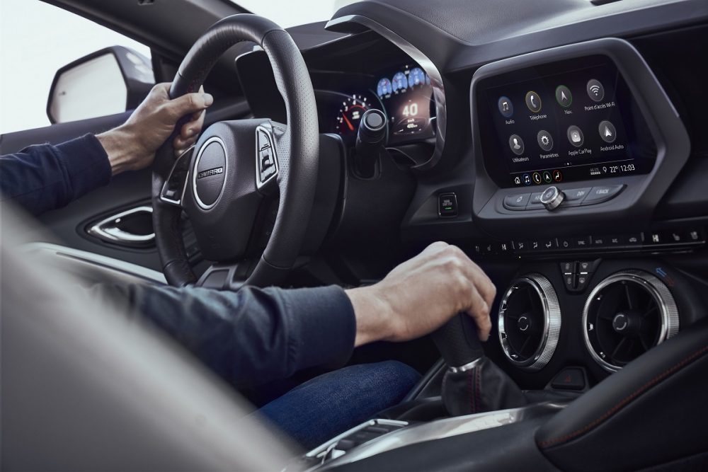 Interior view of 2023 Chevrolet Camaro SS dashboard and shifter.