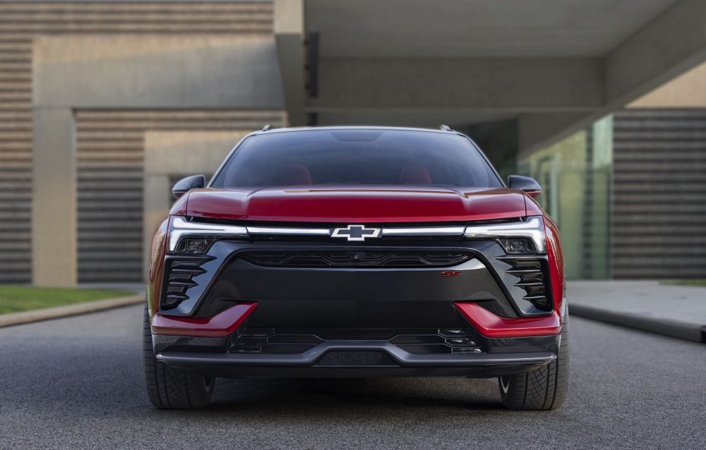 Front view of red 2024 Chevrolet Blazer EV SS with lights illuminated