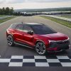 Front side overhead view of red 2024 Chevrolet Blazer EV SS parked at track finish line