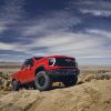 Front side view of 2024 Chevrolet Silverado HD ZR2 Bison climbing a trail