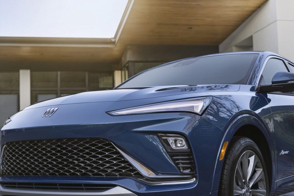 Close-up view of blue 2024 Buick Envista Avenir grille and headlamps