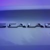 A close-up of the Cadillac ESCALADE IQ name badge seen on the vehicle