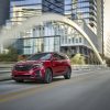 Front 3/4 view of 2024 Chevrolet Equinox RS in Radiant Red Tintcoat.