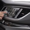 Side view of a person's hand operating the 2024 Buick Enclave's 8-inch infotainment touch screen