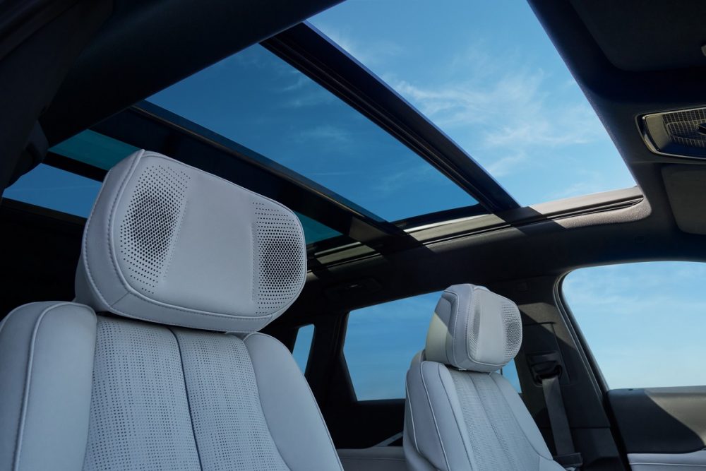 View of the 2024 Cadillac LYRIQ interior, looking up toward the panoramic power opening sunroof.