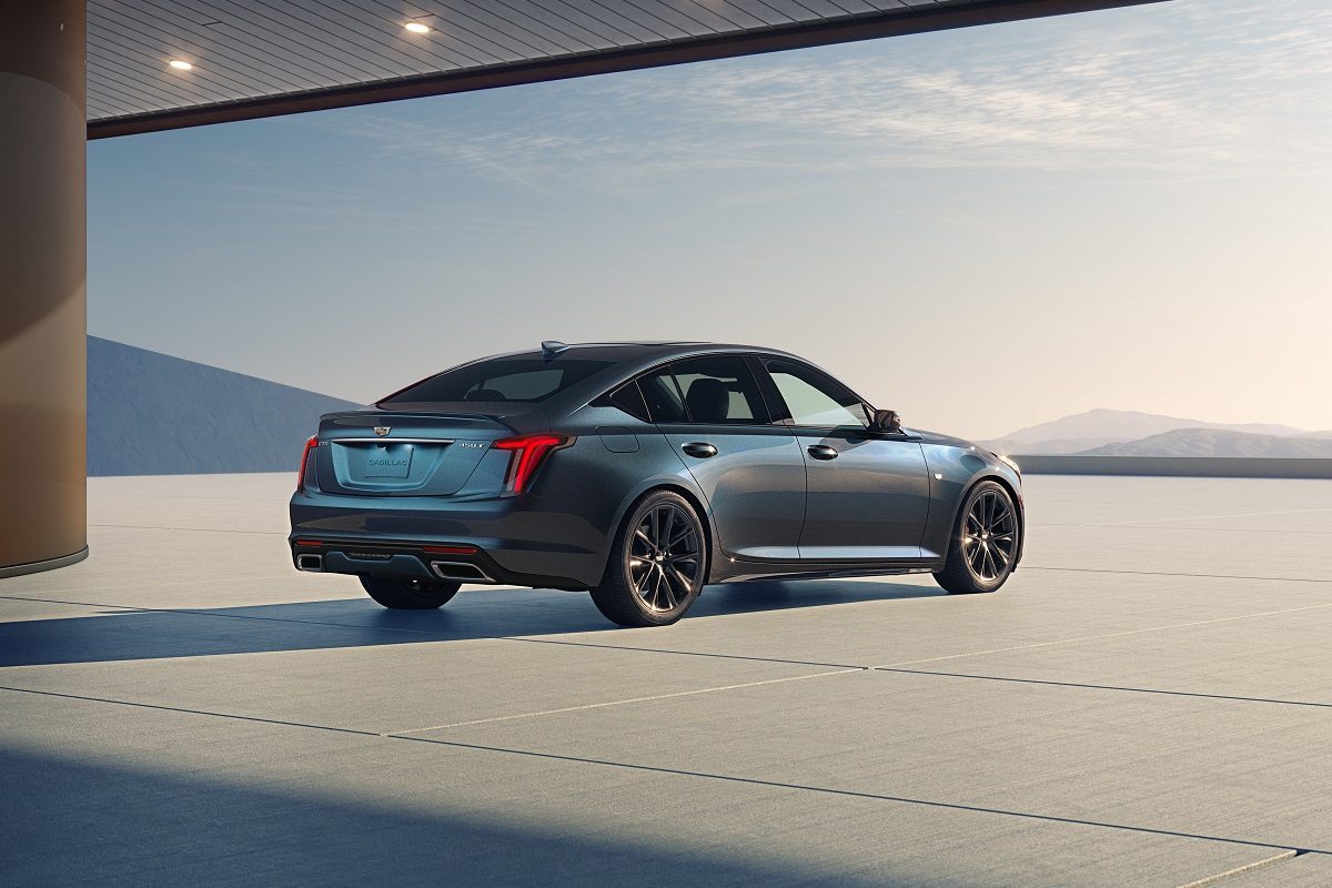 Rear 3/4 view of the 2025 Cadillac CT5 Sport in Deep Space Metallic.